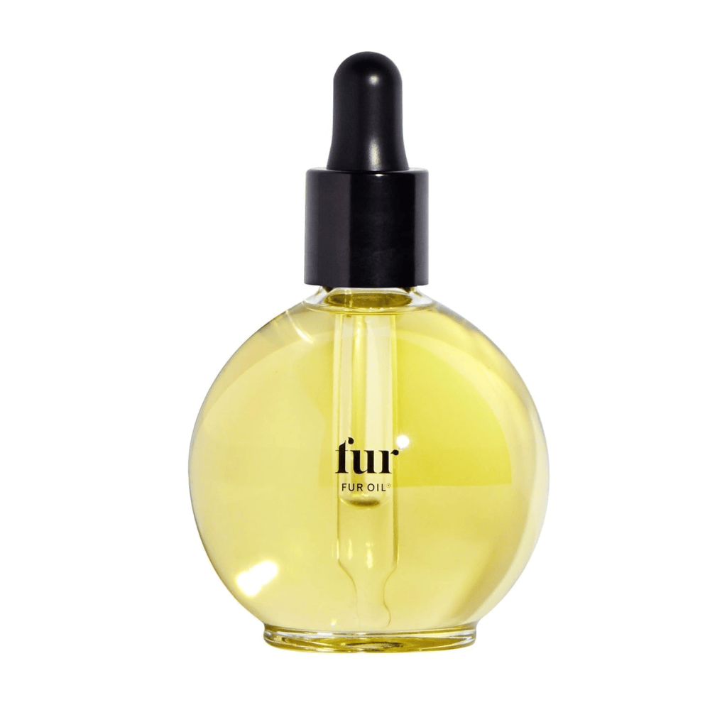A round glass bottle of fur oil with a black dropper cap, containing a yellow liquid.