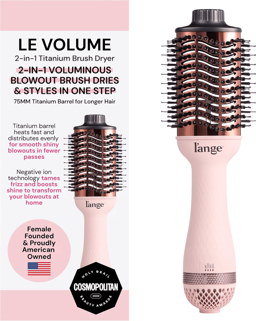 A 2-in-1 titanium brush dryer, labeled 'LE VOLUME', designed for voluminous blowouts and styling in one step. Features a 75mm barrel, negative ion technology for reducing frizz, and a sleek pink design with branding from 'l'ange'.