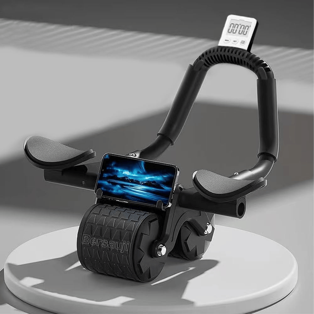 A compact black exercise device with two wheels, featuring grips for hands and a stand for a smartphone displaying a scenic image. A digital timer is mounted on the top.