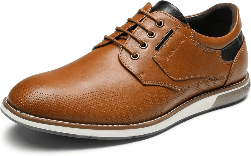 Brown leather dress shoe with perforated design and black accent, featuring a lace-up closure.