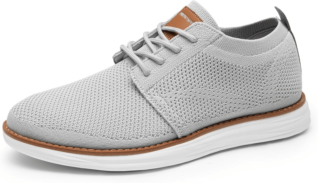 A light gray sneaker with a breathable mesh upper, lace-up design, and a brown synthetic leather accent at the tongue.