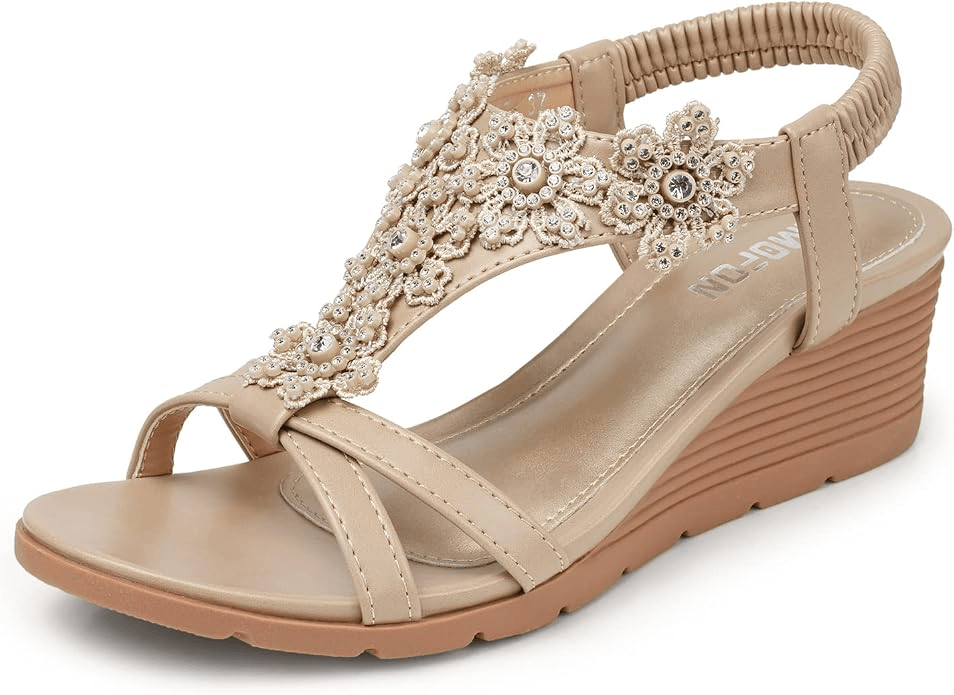 Beige wedge sandal with floral embellishments and a comfortable ankle strap.