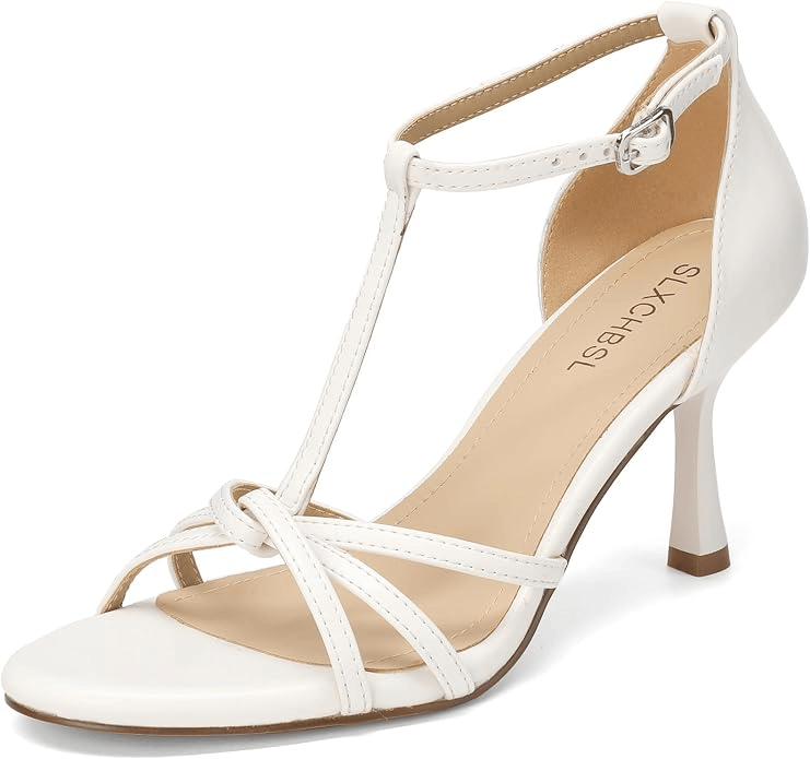 White high-heeled sandal with a T-strap design and crisscross detailing at the front.